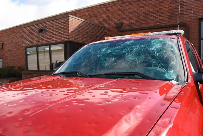 A vehicle in need of hail damage repairs in Lakewood, CO